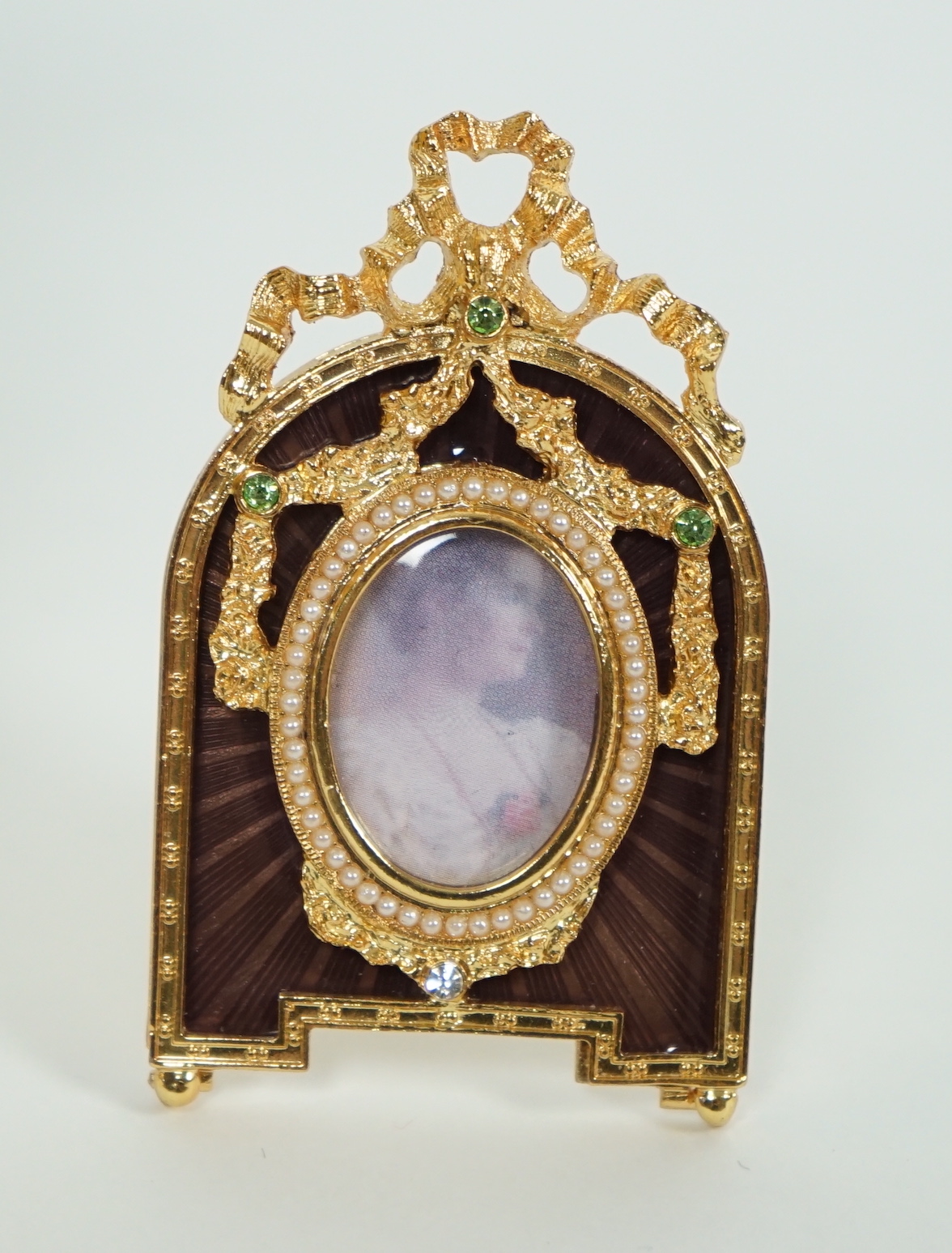 A Fabergé Imperial Collection Menagerie Rabbit Surprise Egg on stand together with a Fabergé gilt and enamel photograph frame